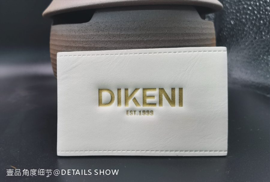 DIKENI white cowhide patch with gold lettering