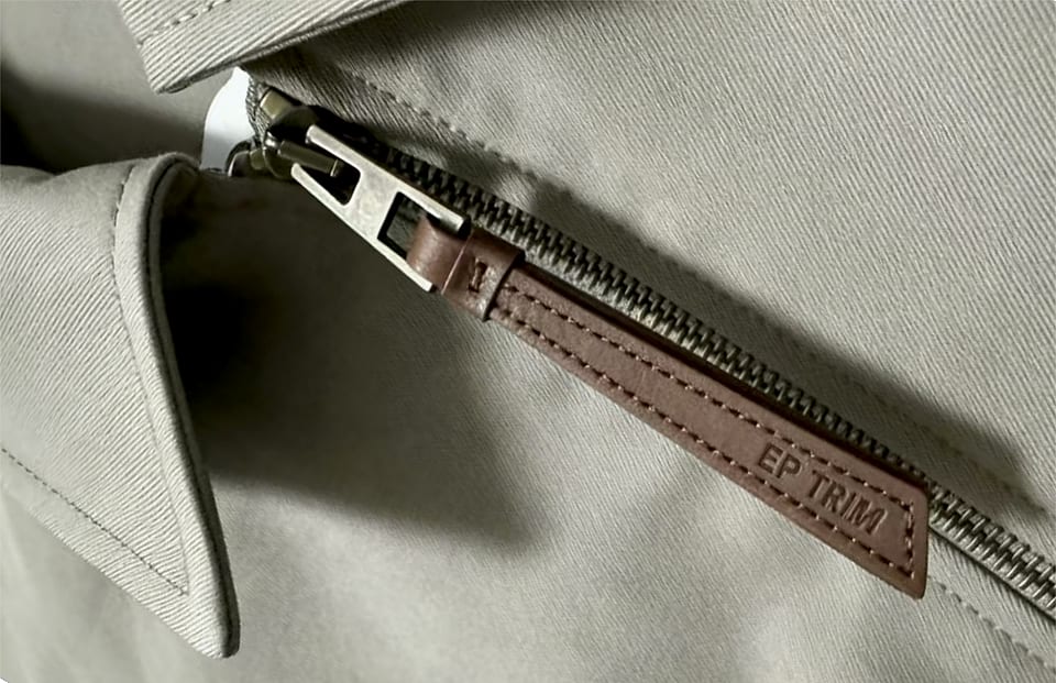 EP TRIM Leather zipper pull photographed — Lightly coated full-grain cowhide — substantial in the hand, developin